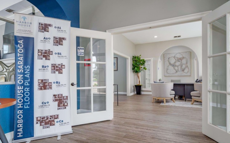 a room with a sign and a table