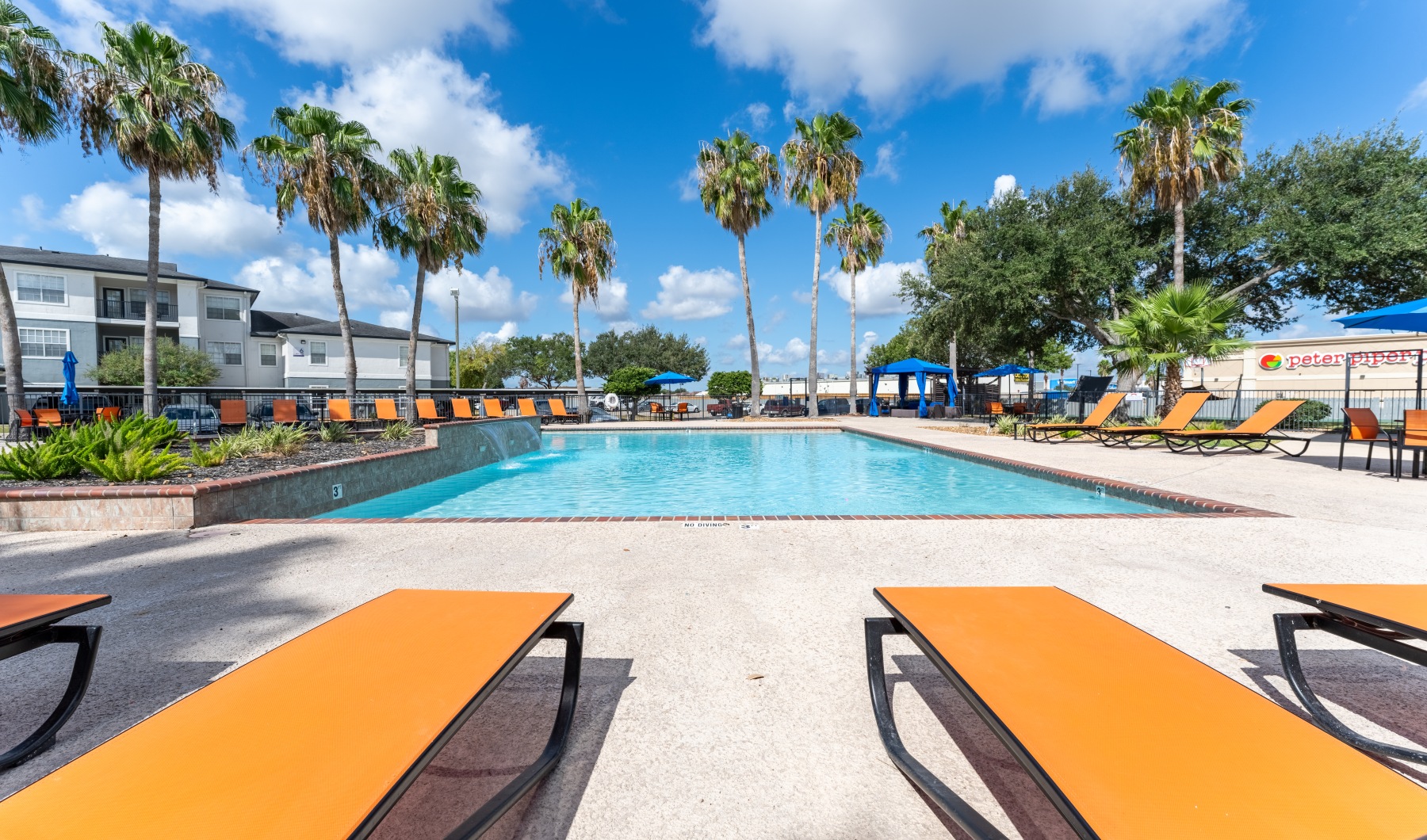 a pool with chairs around it