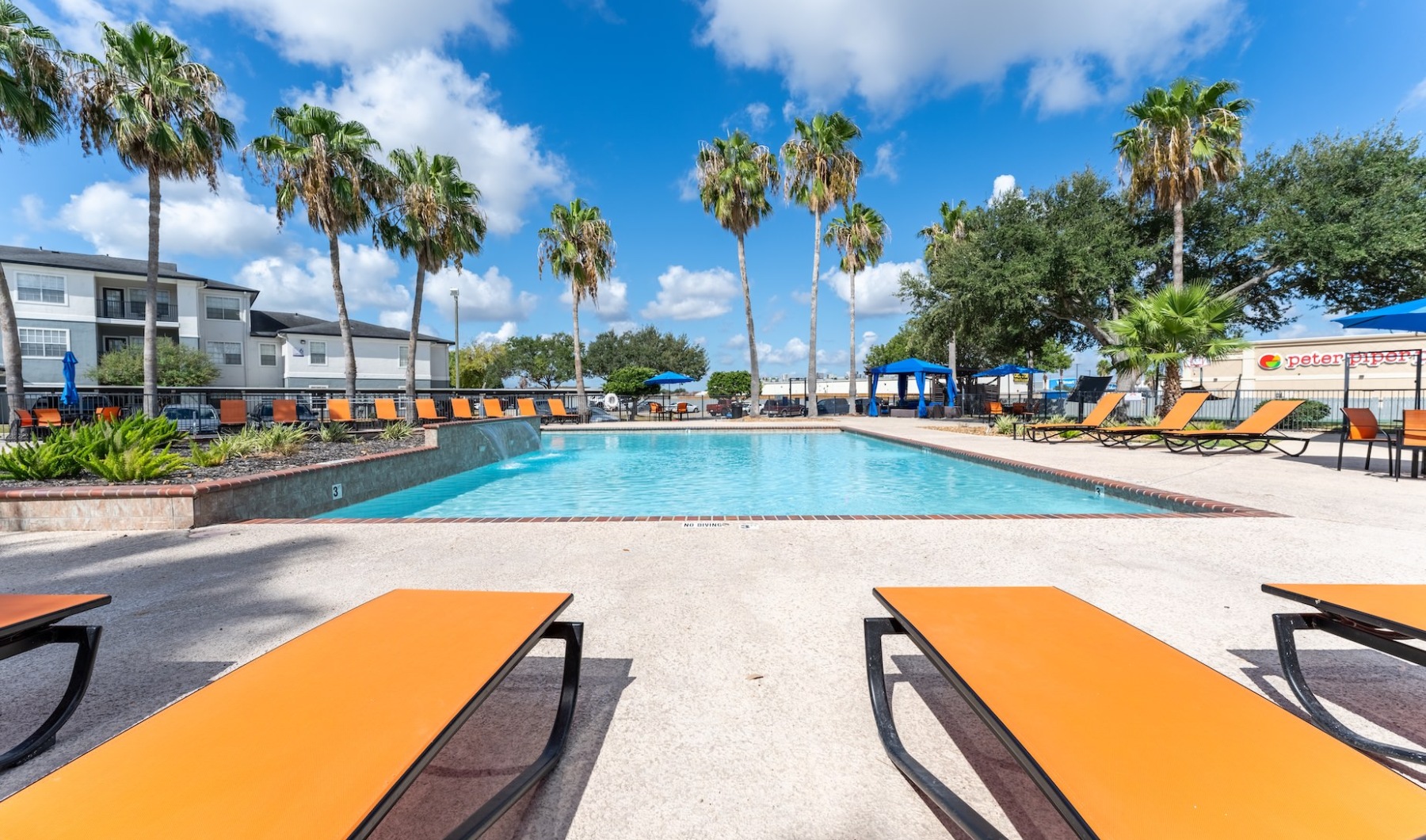 a pool with chairs around it
